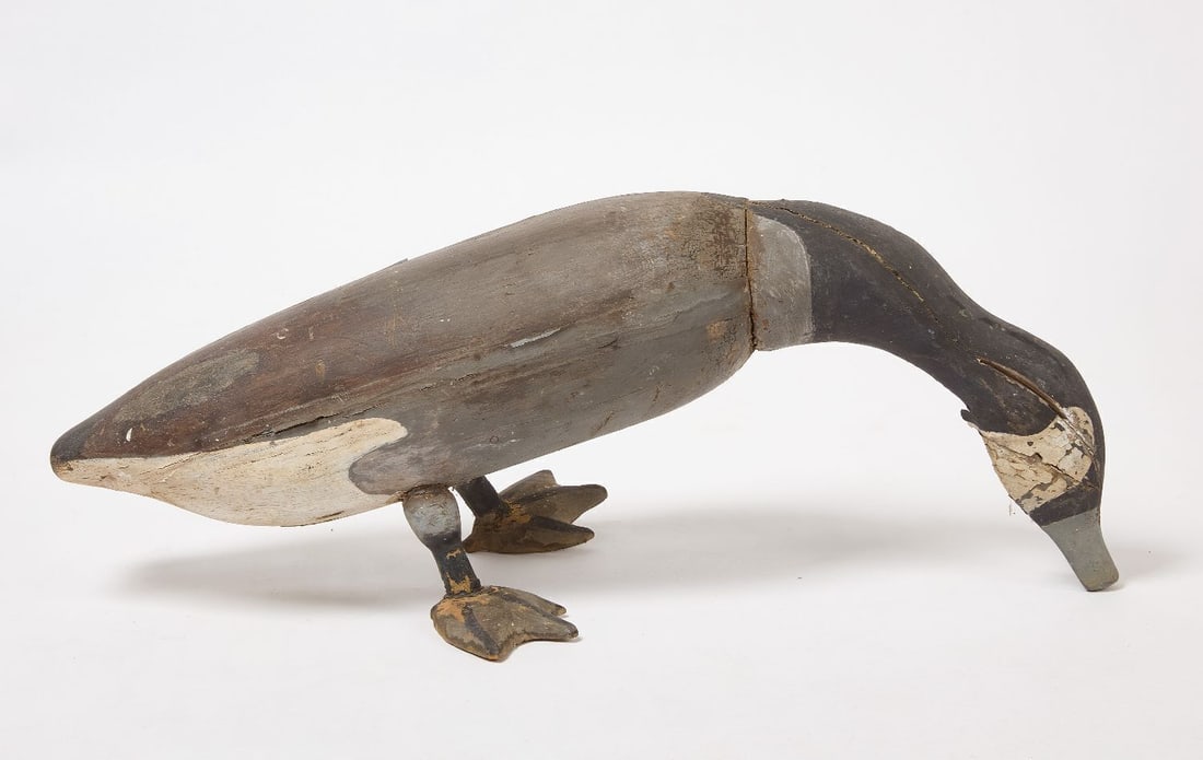 Oversized Folk Art Goose Decoy: Oversized folk art goose decpy with lowered head and neck position. Wood with canvas neck. Old, probbaly oriignal paint. American, early 20th century. H 13-1/2 in. L 34-1/2 in. W 15-1/2 in.