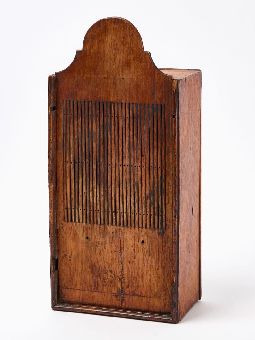 Tape Loom with Skein of Flax Thread: Tape Loom featuring a storage compartment and tombstone crest. Together with a skein of Flax Thread. Carved poplar. American, 18th century. Loom: H 16-5/8 in. W 7 in. Loom Storage Box: H 5 in. L