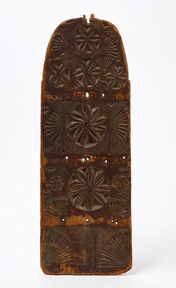 Early Carved Spoon Rack Board: Early spoon rack fragment. Carved wood with remnants of old paint. New England, last quarter of the 18th century. H 25 in. W 8-3/4 in.