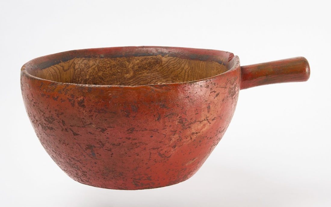 Painted Handled Burl Bowl: Large burl bowl with handle in old red paint. Black inner ring on the inside edge. North America, circa 1800. H 7-1/2 in. D 15 in. Handle only: L 4-1/2 in. 