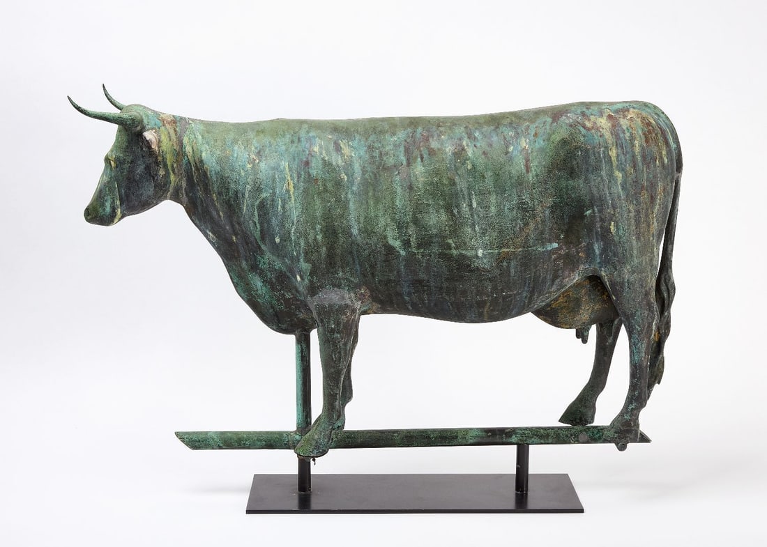 Cow Weathervane: Full-bodied cow weathervane. Hollow-body copper construction. Fine original verdigris surface. American, circa 1885. Stand included as shown. H 19-1/2 in. L 32 in. D 6 in.