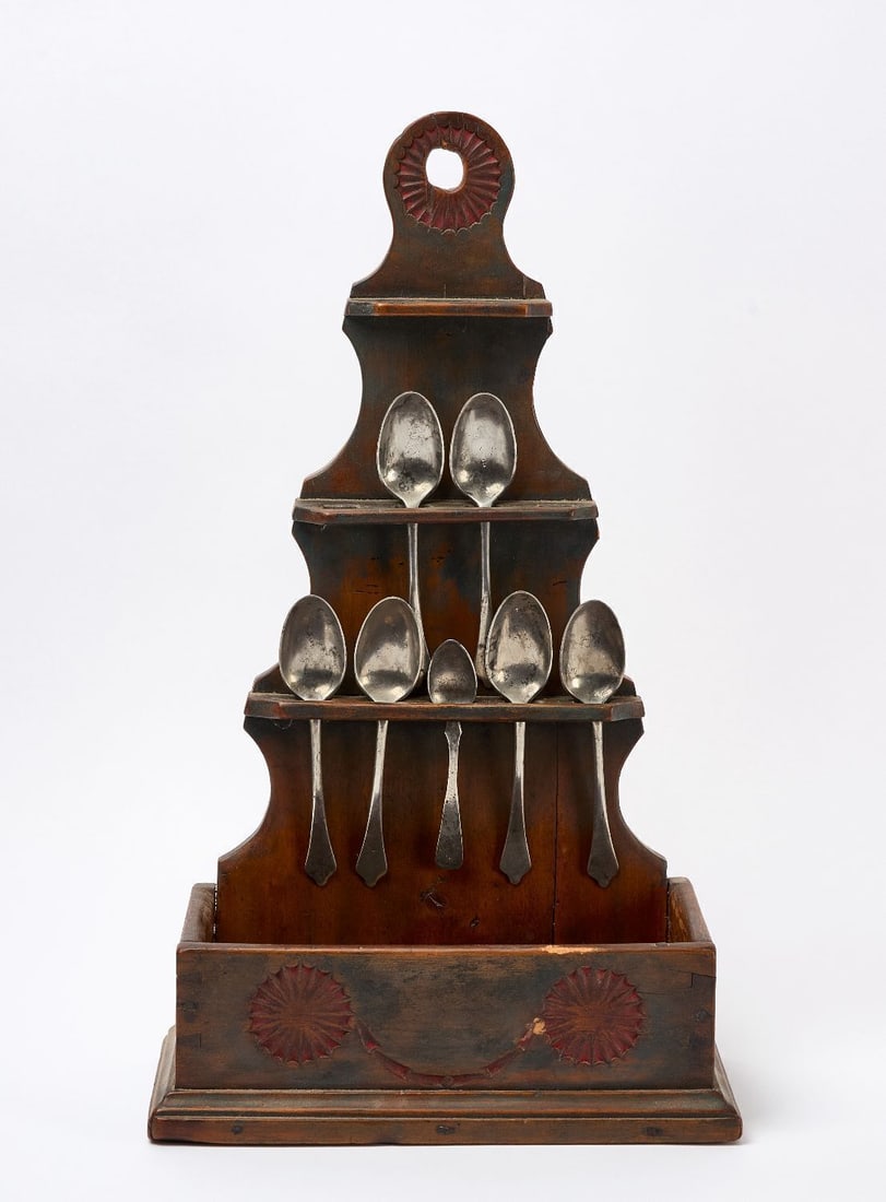 Three-Tiered Painted Spoon Rack: Three-tiered carved and painted spoon rack. Includes 7 period pewter spoons. Pine. Dovetail and forged nail construction. New England, 19th century. Provenance: Sotheby's Parke-Bernet, Winterhur