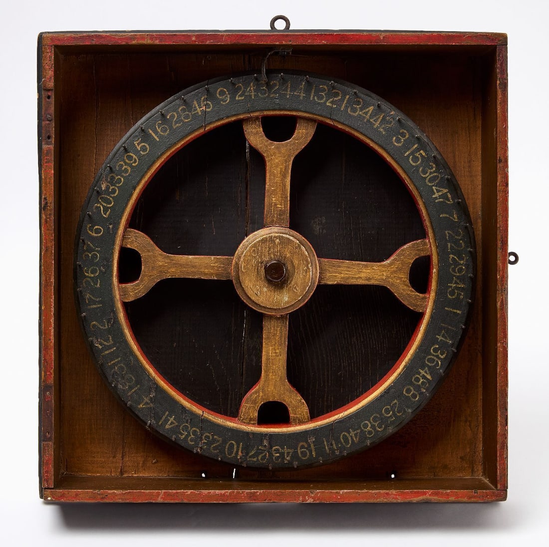 Carnival Game Wheel: Carnival game wheel. Original paint on wood, mounted in it's oriignal box frame. American, Early 20th Century. H 15-1/2 in. W 15-3/4 in. Collection of Bruce and Doranna Wendel.