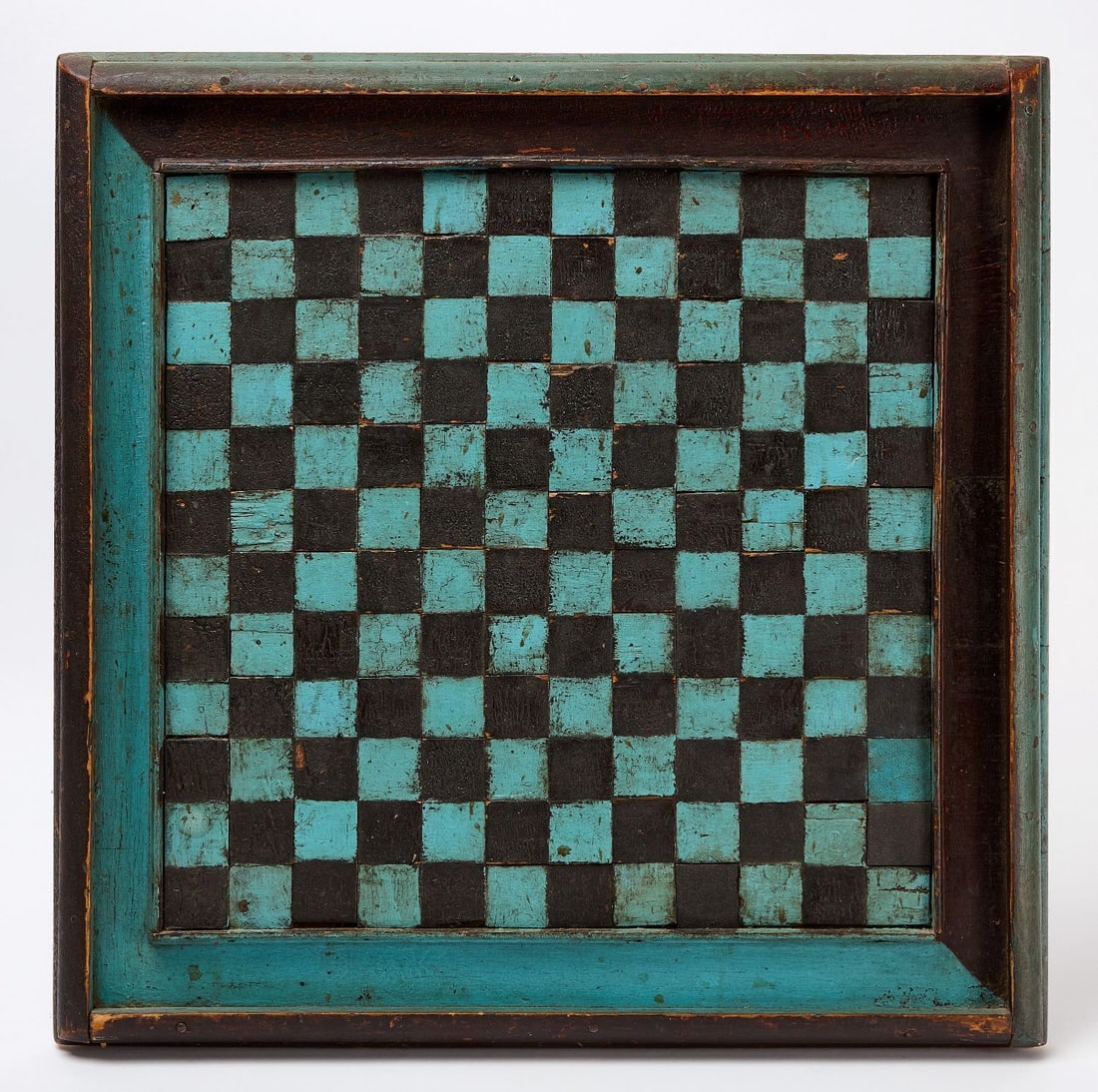 Checkers Gameboard: Unusual checkers gameboard painted in black, and blue. Each checker square an individual wood block. Oversized scale. Original paint on framed wood panel. American, lcirca 1900. H 24 in. W 24 in