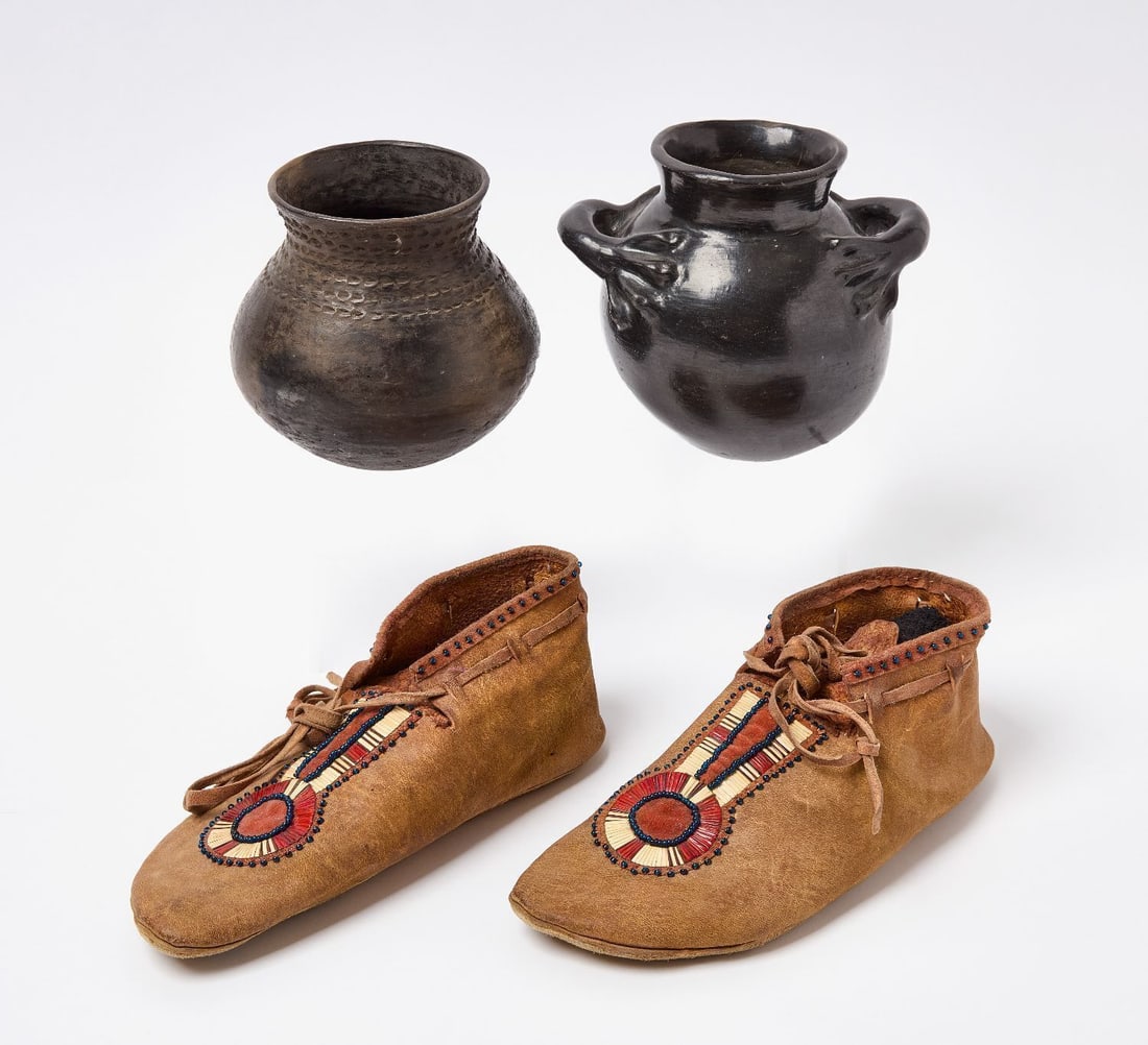 Native Pottery and Moccasins: Pair of quill work Native quill work moccasins. Together with two Native pots. One pot with applied figural handles. Moccasins: L 10 in. Pots: H 6-1/2 in and 6 in.