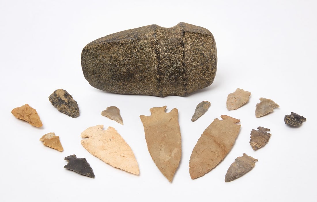 Group of Native American Stone Implements, Including Ax Head: Group of Native American stone implements, comprising a grooved ax head together with numerous knapped stone points, blades, and arrowheads in various cherts and other lithic materials. Native America