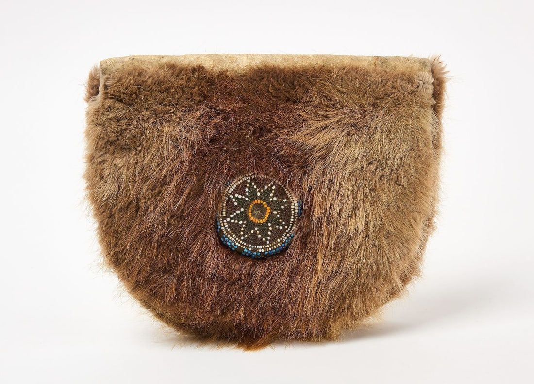 Native Beaver Fur Bag: Native America beaver fur bag with geometric beaded medallion, 19th century. H 10 in. W 12 in.