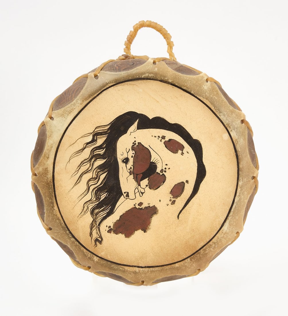 Native Drum: Hand-painted Native drum featuring horse motif. 20th century. D 13-1/2 in. 