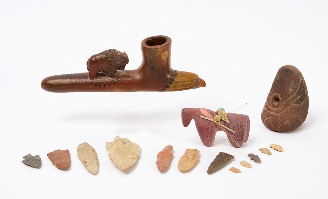 Group of Native American Implements: Group of Native American Implements. Includes 12 lithics , a small carved stone horse fetish, a Dine pottery pipe with a buffalo figure and eagle end signed 'L. Blake' to underside, and a