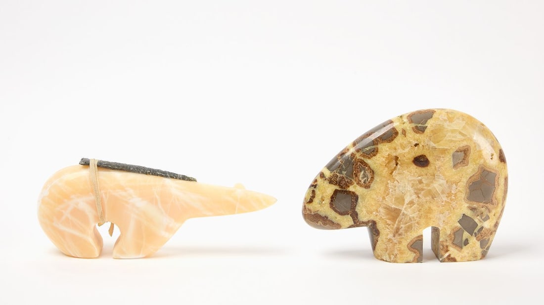 Two Stone Zuni Bears: Two carved stone zuni bear fetishes one with arrowhead on top 20th century. H 6-3/4 in. W 9 in. H 4-1/2 in. W 10-1/2 in.