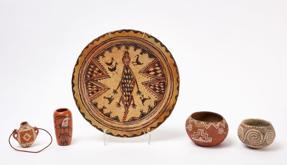 Group of Native Pottery: Five pieces of Native pottery including a Berber decorative dish, redware pottery vase with bird motif, earthenware canteen with geometric designs, redware pueblo pottery bowl with geometric