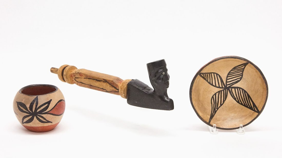 Pipe and Stem and Pottery: Stone pipe with head and turtle, carved wooden stem.Together with two small pueblo pottery vessels. H 3 in. D 4 in. H 3-3/4 in. L 12-1/2 in. H 1-1/2 in. D 5-3/4 in.