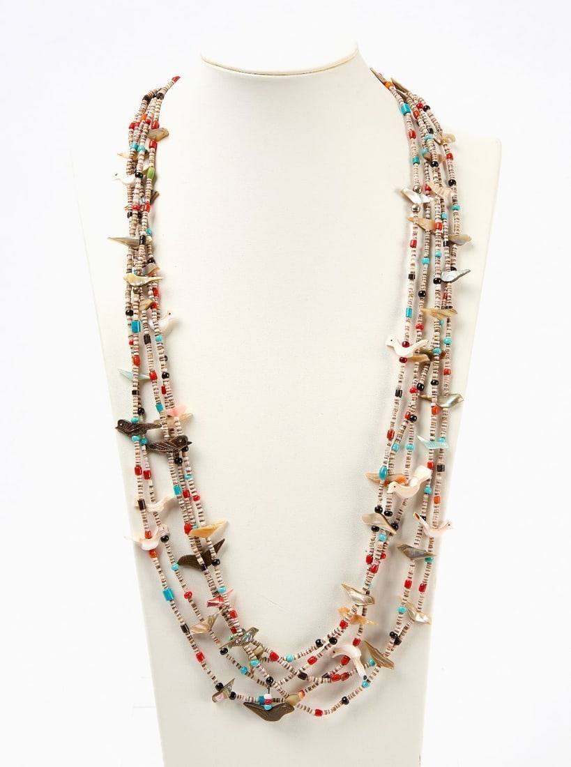 Native American Fetish Necklace: Native American fetish necklace. Carved mother-of-pearl, red coral, spiny oyster, and other stones. Southwestern US, second half 20th century. L (clasped) 16-1/2 in.