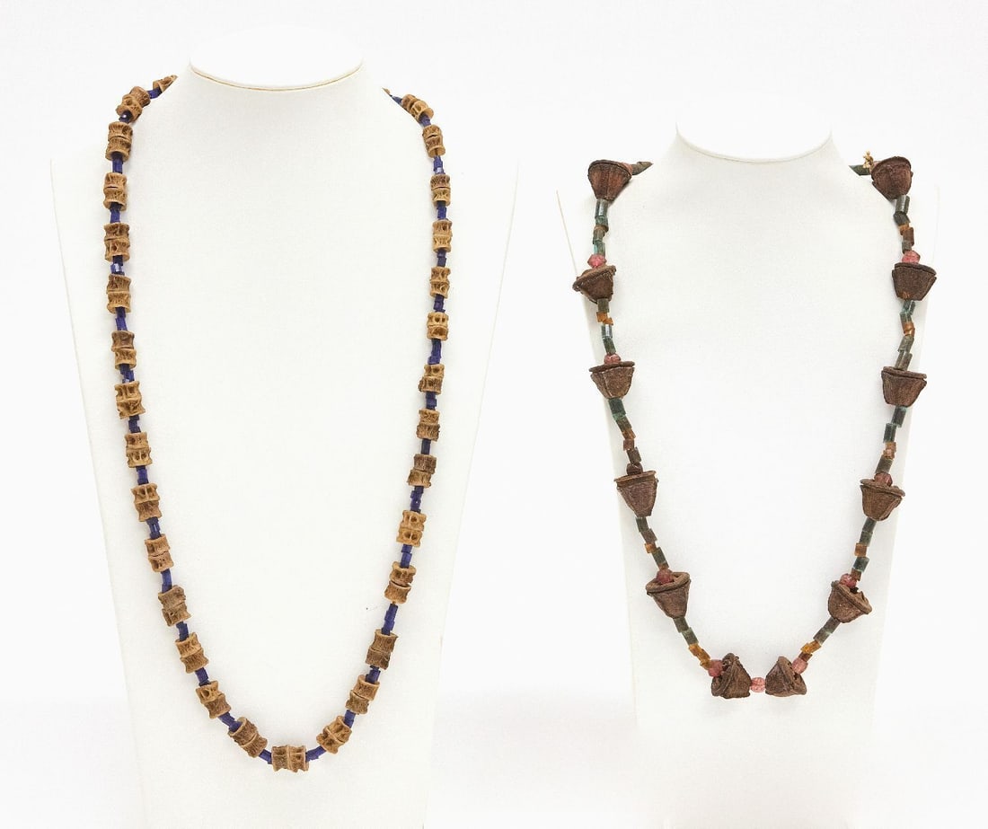 Two Native American Necklaces: Two Native American handmade necklaces rattle snake vertebras and seed pod. 20th century. L 16 in. L 13 in.