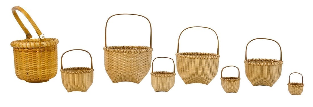 Group of Small Baskets: One Nantucket basket with seven nesting baskets. Single Nantucket basket with inscribed base and dated 1983. Late 20th century. Largest Nesting Basket: H 5-3/4 in. Inscribed Basket: H 6-5/8 in.