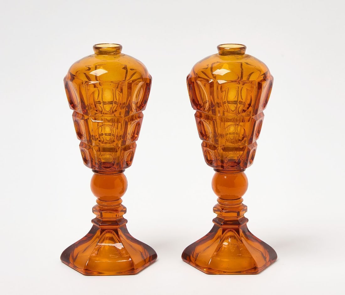 Pair of Westmoreland Oil Lamps: Pair of Westmoreland amber glass thumbprint oil lamps. H 9 in. D 4 in.