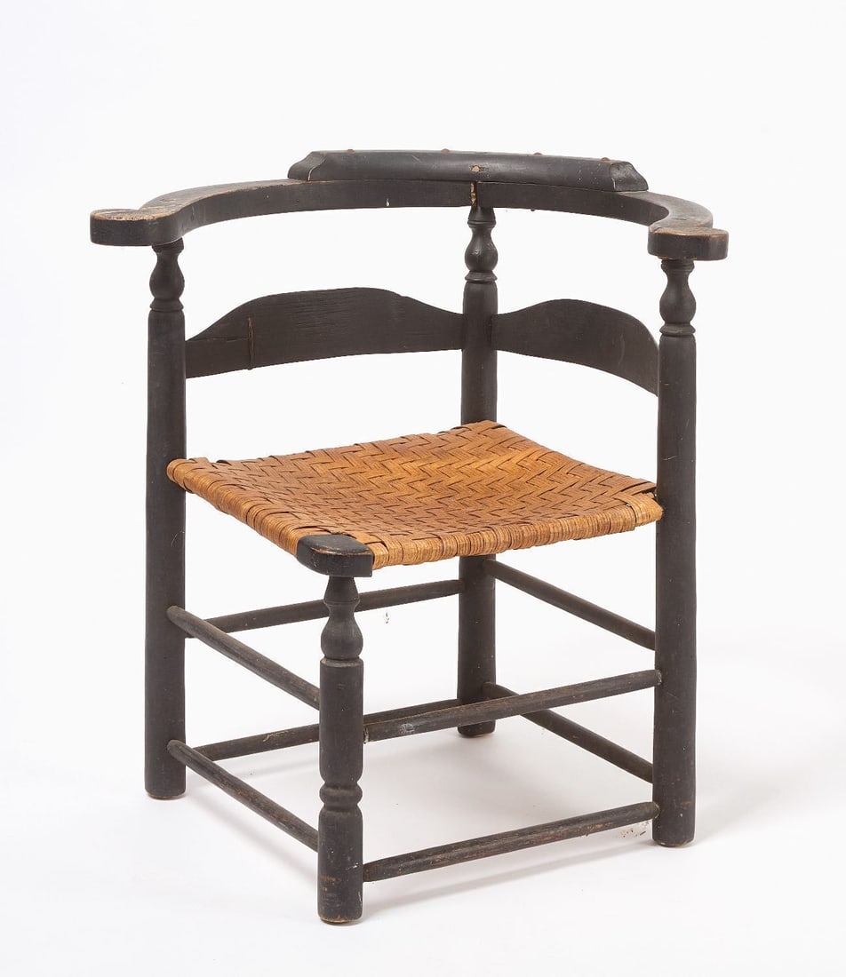 Corner Chair in Black Paint: Corner chair in old black paint. Pegged construction. American, 18th century. H 28-3/4 in. W 24-3/4 in. D 26-1/4 in. SH 15-1/2 in.