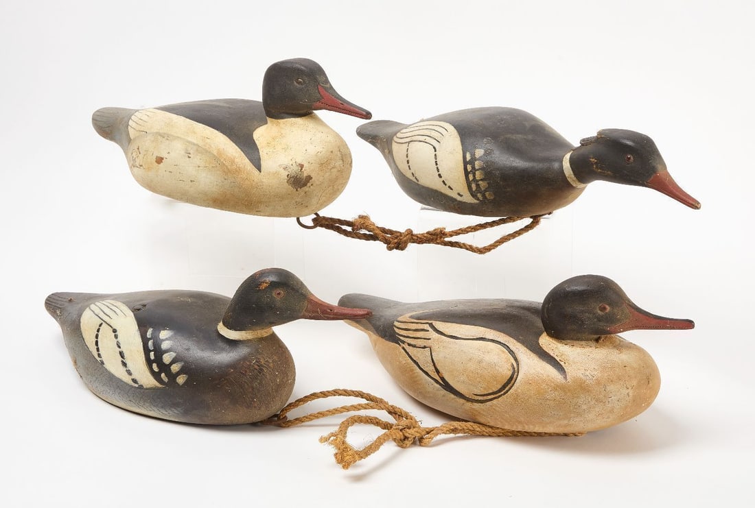 Four Duck Decoys: Four hand carved wooden duck decoys. 20th century. H 3 in. L 22-1/2 in. H 7-1/2 in. L 19 in. H 6-1/2 in. L 17-3/4 in. H 6-1/2 in. L 18-1/2 in.