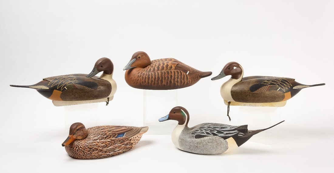 Five Duck Decoys: Lot of five carved and painted wooden duck decoys some are singed on the bottom. 20th century. H 7-1/2 in. L 21 in. H 8 in. L 19 in. H 8 in. L 20-1/2 in. H 5-1/2 in. L 16 in. H 7 in. L 17 in.