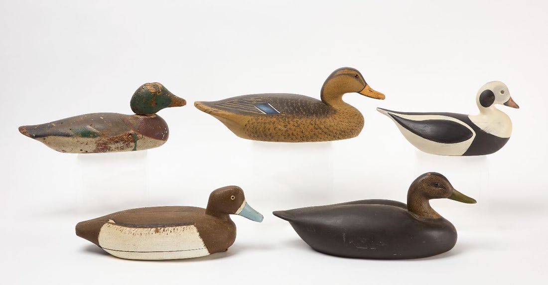 Lot of Five Duck Decoys: Lot of five duck decoys some are signed on the bottom. Carved and paint wood. H 5-1/2 in. L 15 in. H 6-1/2 in. L 16-1/2 in. H 6-1/2 in. L 17-1/4 in. H 5 in. L 15 in. H 7 in. L 12-1/2 in.