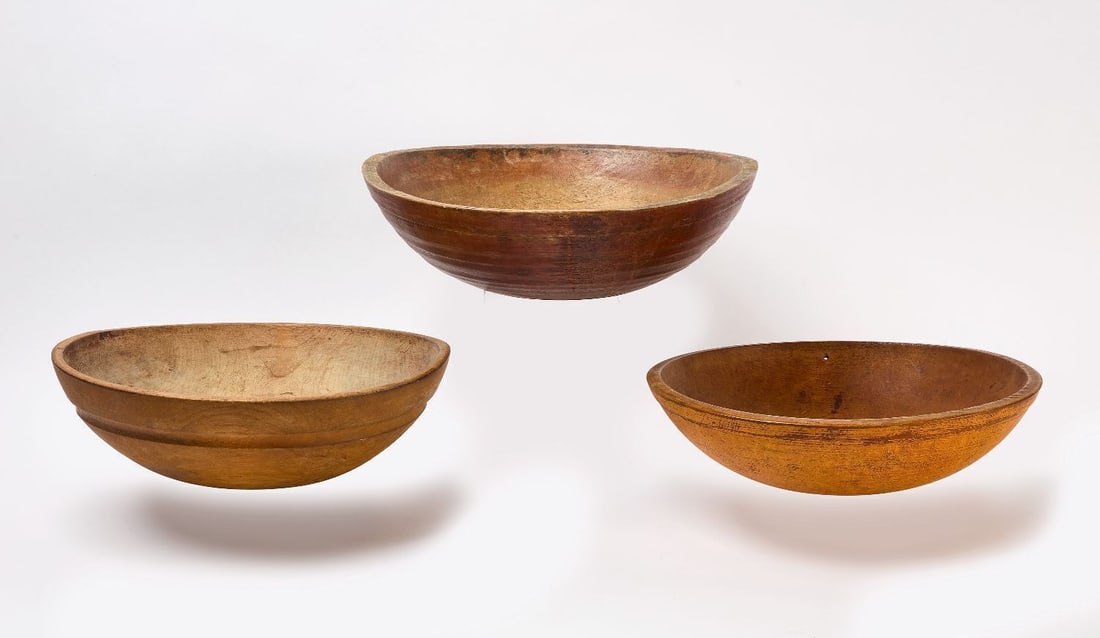 Three Turned and Painted Bowls: Three turned and painted bowls Original, Yellow and Red paint. New England, mid 19th century. H 5 in. D 16 in. H 5-1/2 in. D 17-1/4 in. H 5-3/4 in. D 18-3/4 in.