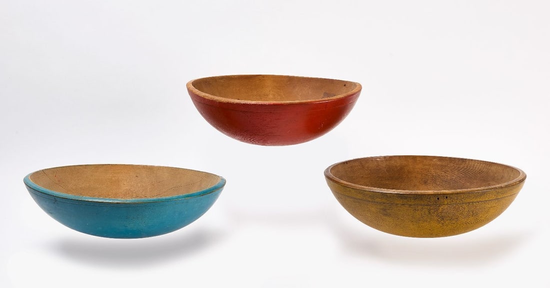 Three Turned and Painted Bowls: Three turned and painted bowls. America, 19th century. Red bowl: H 5 in. D 14-1/2 in. Blue bowl: H 4-1/2 in. D `4-3/8 in. Mustard bowl: H 5-3/8 in. D 17-1/2 in.
