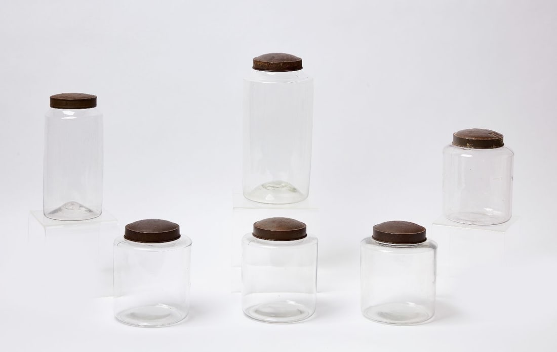 Six Blown Glass Storage Containers: Six blown glass storage containers with tin tops. American, mid 19th century. H 7-1/4 in ( 4), 9-3/4 in.12 in. 