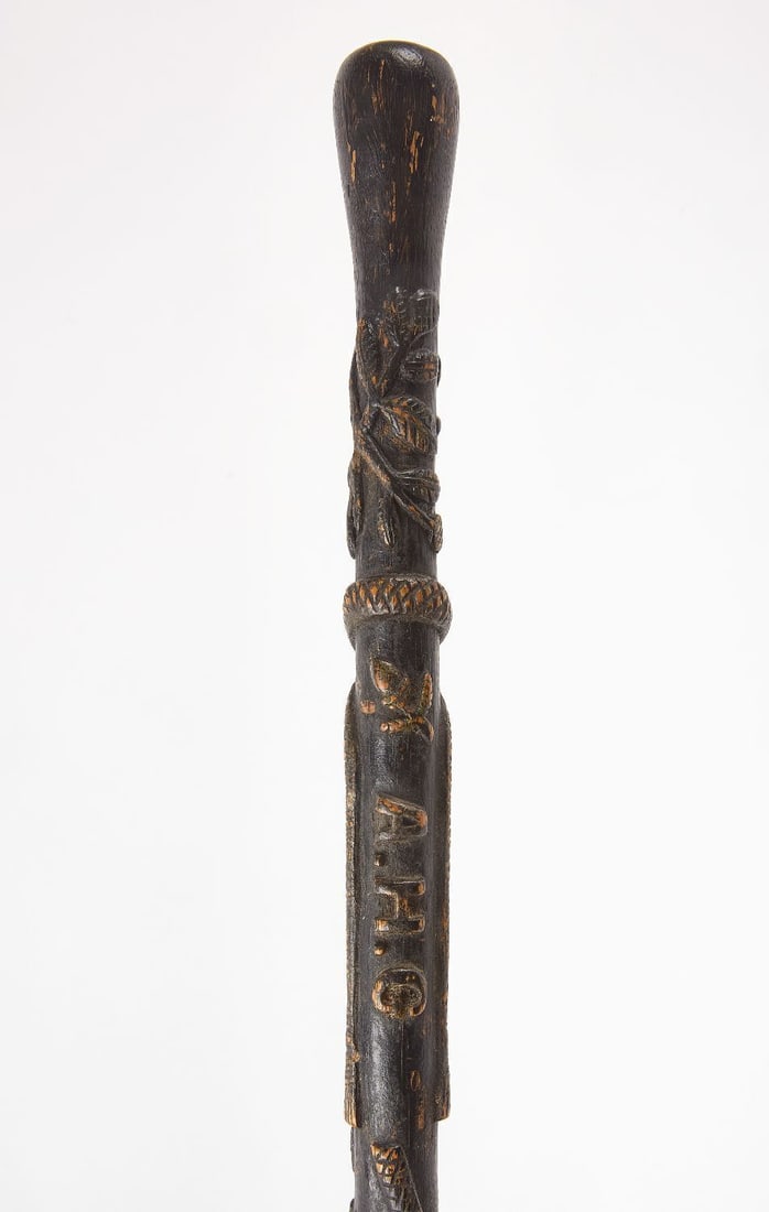 Folk Art Walking Stick: Folk art walking stick. Carved and painted wood with branch and leaf motifs. American, first half of 20th century. L 35-1/4 in.