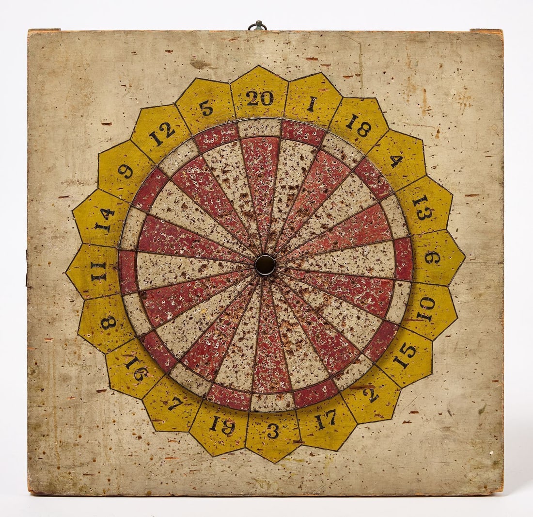 Dartboard: Dartboard game with numbering. double sided. Original paint on wood panel. American, circa 1930. H 23-1/4 in. W 24 in. Provenance: Collection of Bruce and Doranna Wendel.