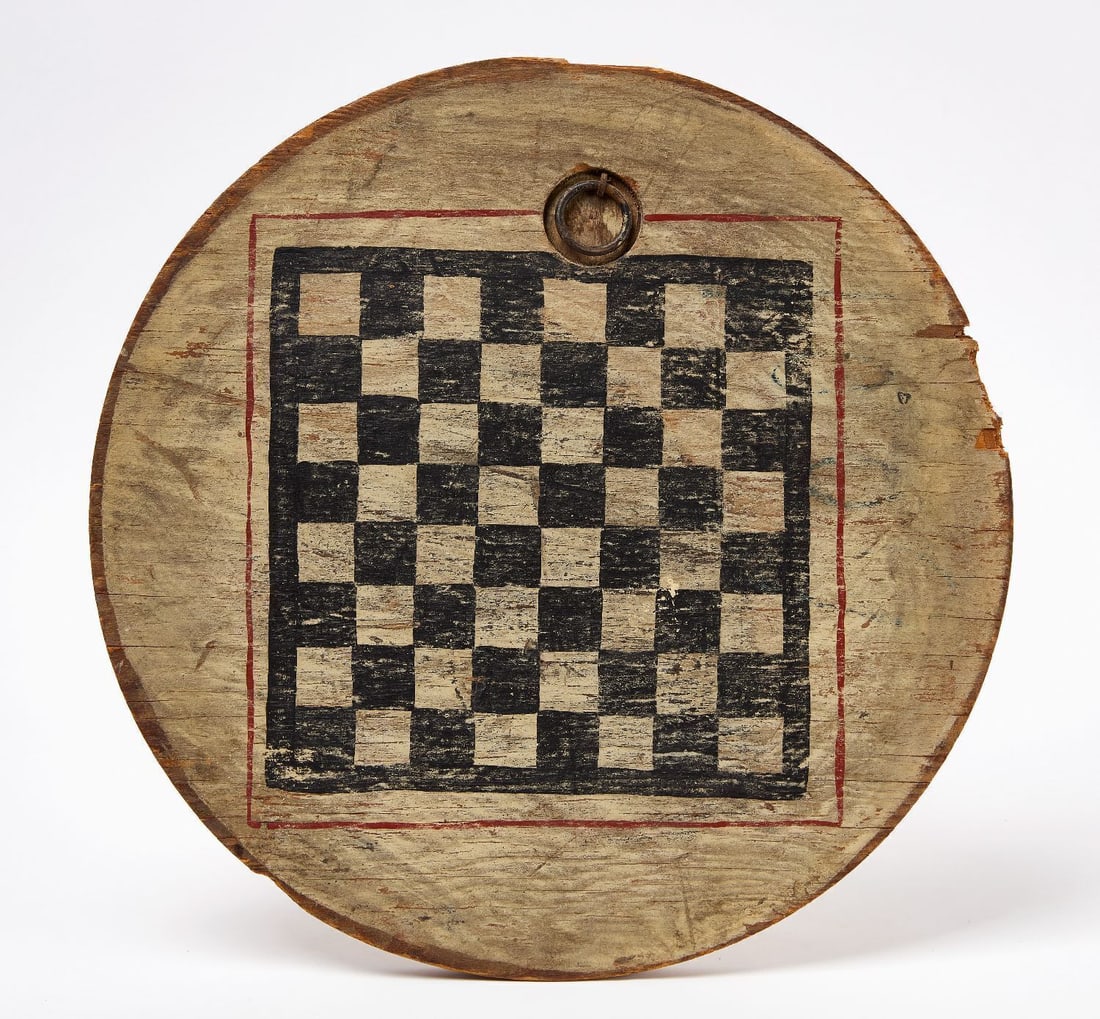 Checkers Gameboard: Checkers round gameboard. Original paint on wood panel. American, late 19th century. D 15 in. Collection of Bruce and Doranna Wendel.