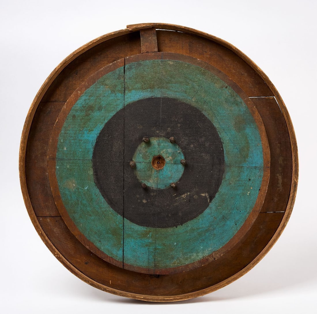 Roulette Wheel Gameboard: Roulette wheel gameboard. Original paint on wood panel. American, Early 20th Century. D 26-1/2 in. Collection of Bruce and Doranna Wendel.