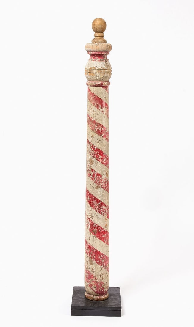 Early Barber Pole: Early barber pole. Turned wood in original red and white paint. American, circa 1870. Mounted to custom wood base. H (incl. base) 61-1/2 in.