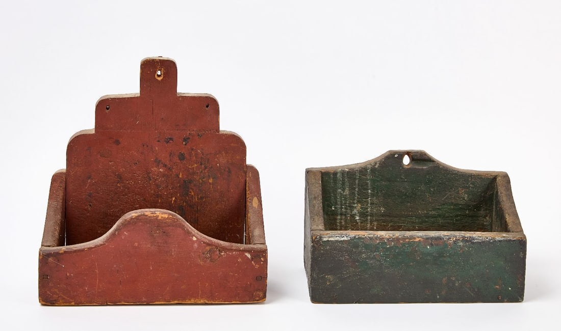 Two Painted Candle Boxes: Two candle boxes. Both pine in old green and red paint respectively. Wrought nail construction. American, early 19th century. H 7-1/4 in. W 12 in. D 5-7/8 in. and H 13 in. W 12-3/8 in. D 4-5/8 in.