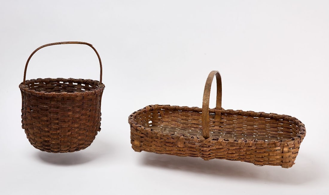 Two Splint Baskets: Two Splint Baskets. One shallow gathering splint basket together with one round splint basket. Gathering Basket: H 10 in. L 23-5/8 in. W 14-1/8 in. Round: H 13-1/4 in. Dia. (opening) 10-7/8 in.