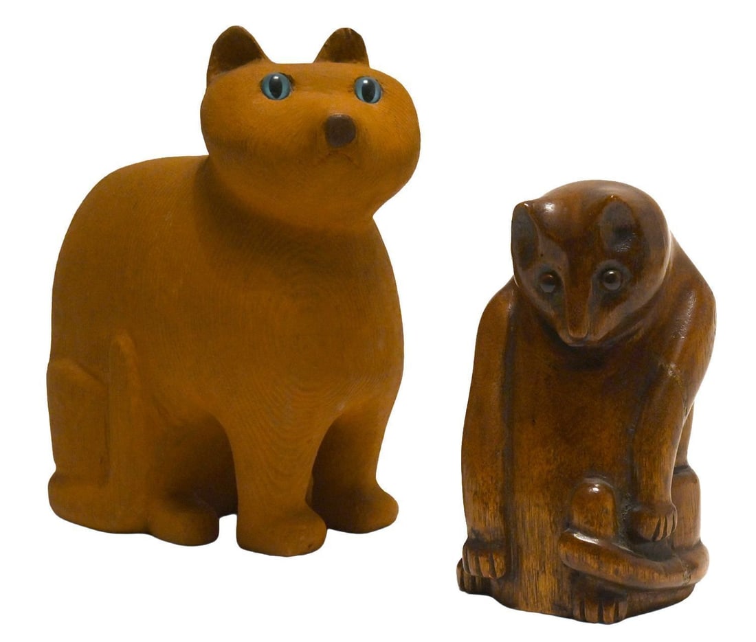 Two Folk Art Carved Cats: Two folk art carved cats. One named 'Goldie' and signed 'Murphy' underneath. The other retains old sticker underneath indicating that it was made from an old table leg. American, 20th