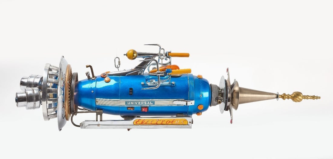 Jimmy Descant - Universal Blue Starship: Jimmy Descant - Universal Blue Starship. Assemblage of Electrolux vacuum cleaner, metal found objects. Signed. L 51 in. H 14 in. Provenance: Purchased directly from the artist,