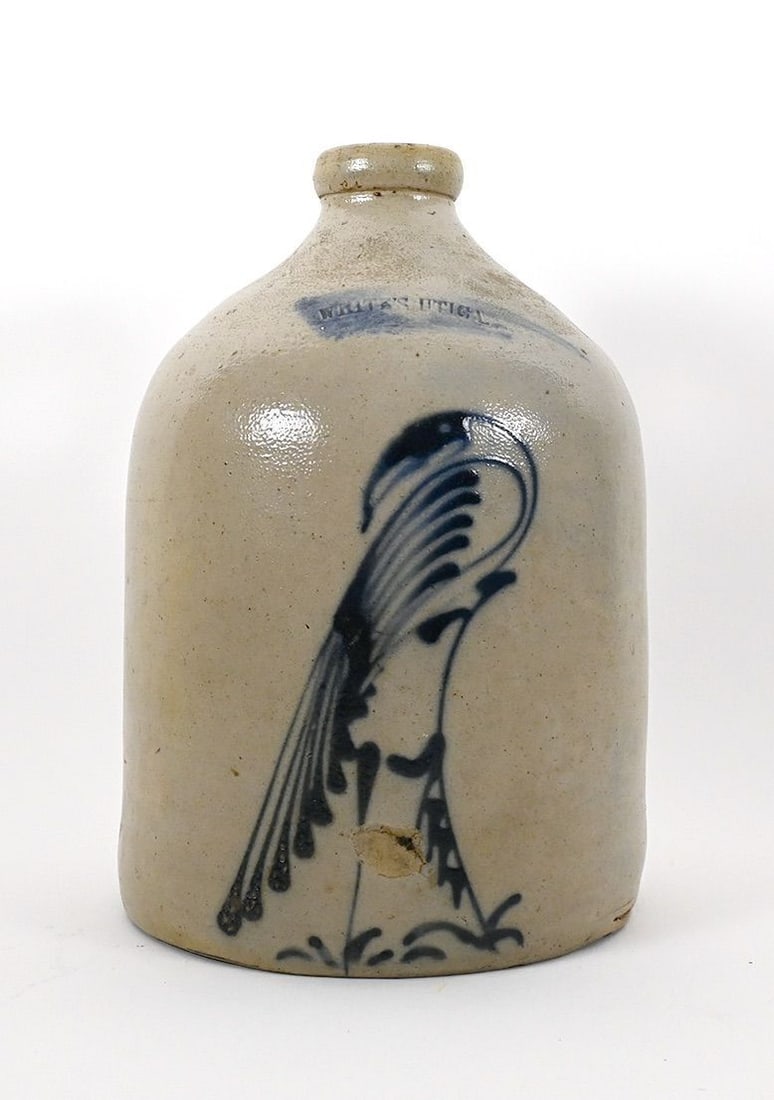 Stoneware Jug with Bird: Stoneware Jug with cobalt bird/parrot decoration. Stamped "WHITES UTICA," NY State origin, circa 1870. H 10-1/2 in. Dia. 7-1/4 in. 