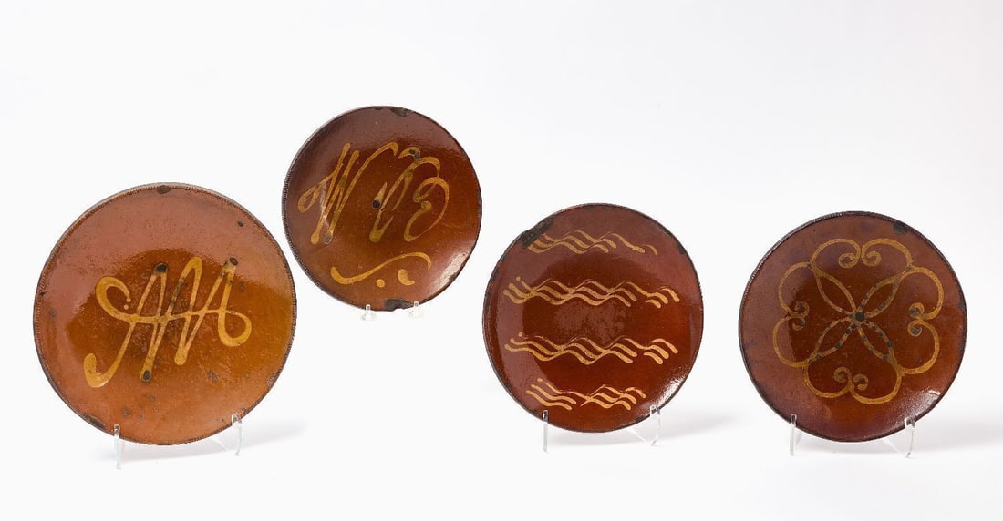 Four Norwalk Slip-Decorated Redware Plates: Four Norwalk, Connecticut, slip-decorated redware plates. The group includes an example with an incised heart motif, illustrated on page 10 of Slip Decorated and Glazed Plates Attributed to the Day
