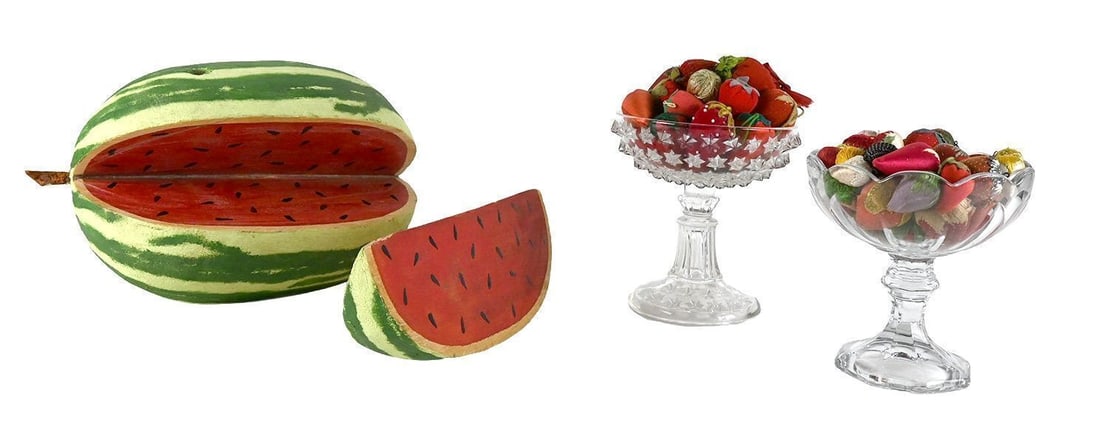 Folk Watermelon and Two Compotes with Fruit Pincushions: Group of folk Americana items comprising a carved and painted wood watermelon-form box with cut wedge slice; together with two pressed glass compotes, each filled with an assortment of fabric