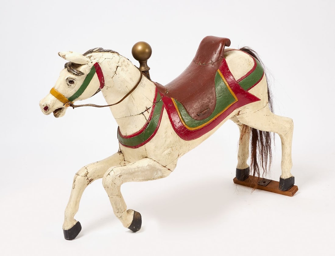 Child's Carousel Horse: Child's carousel horse. Carved wood with original polychrome paint and mohair tail. American, circa 1920. (Approx.): H 28-3/4 in. L 40-1/2 in. W 11 in.