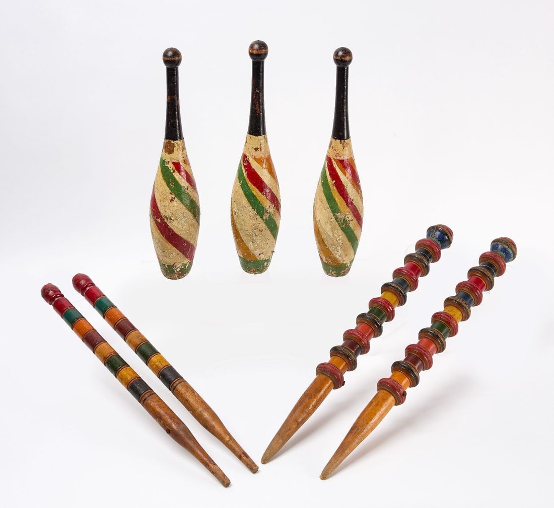 Group of Pins and Juggling Clubs: Group of three juggling clubs and four croquet stakes. Carved and painted wooden. circa 1920-1940. H 19 in. to 26-1/2 in.