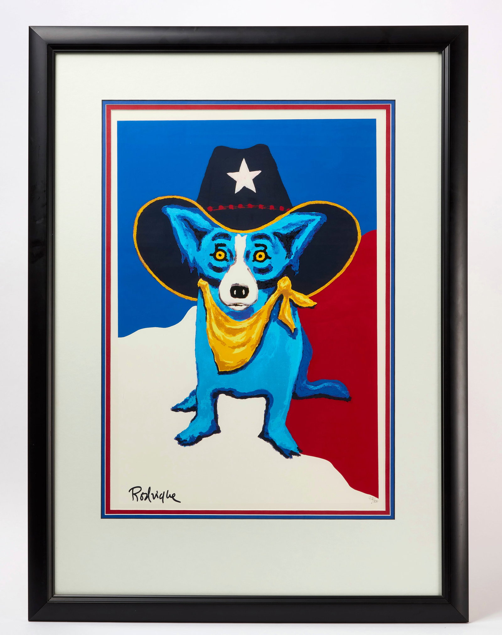 George Rodrigue - 'I Wanna Be a Texas Ranger' Blue Dog Screenprint: George Rodrigue (1944-2013, born New Iberia, Louisiana), "I Wanna Be a Texas Ranger," from the artist's Blue Dog series. Color screenprint on paper, depicting Blue Dog wearing a black