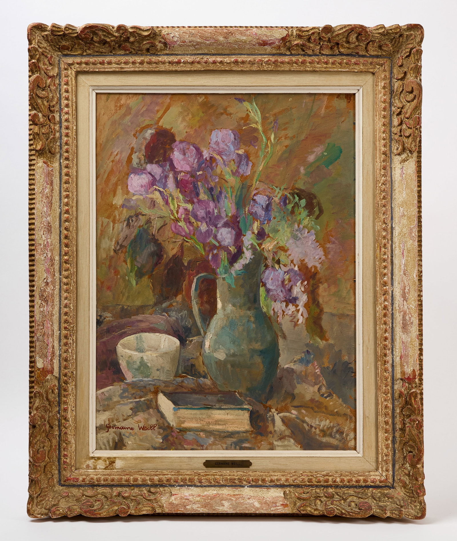 Germaine Weill - Tabletop Still Life with Vase of Flowers: Germaine Weill (French, 1893–1971), Still Life of a pitcher with flowers, a book and bowl on a table. Oil on canvas, mounted in later frame in distressed paint. France, late 19th century to
