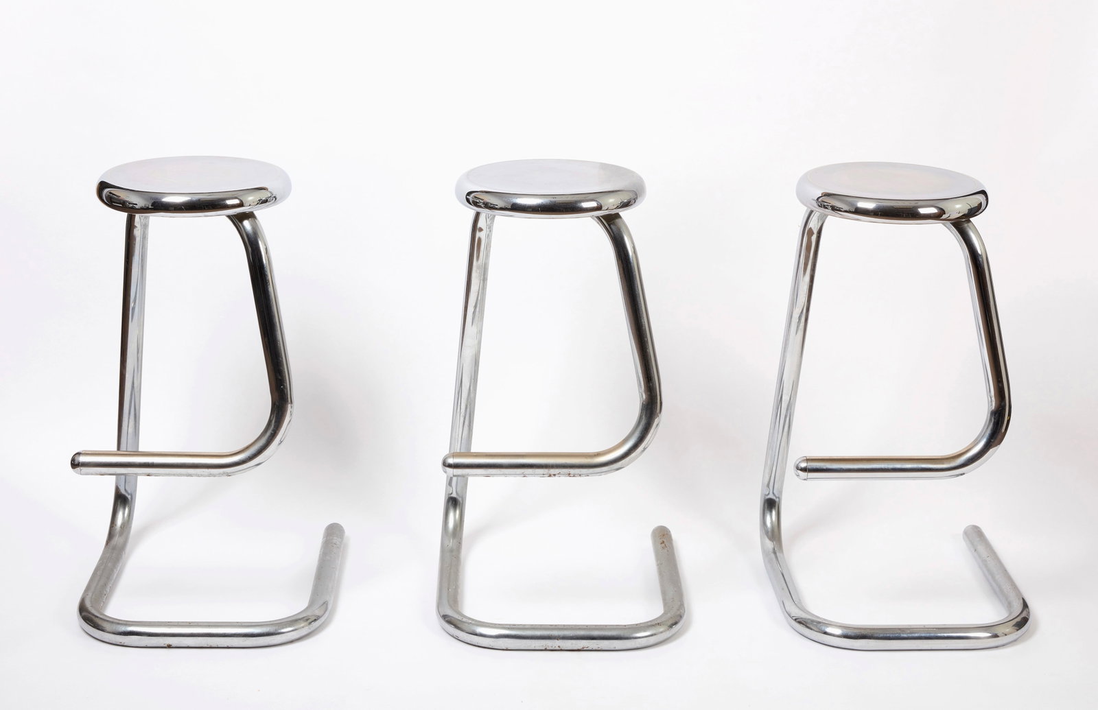 Three Chrome Kinetics 'Paperclip' Bar Stools: Three "Paperclip" Bar Stools by Kinetics, Model K700. Chrome finished, with brand label to underside. Designed in 1969 by Hugh Hamilton and Philip Salmon, the Paperclip stool is