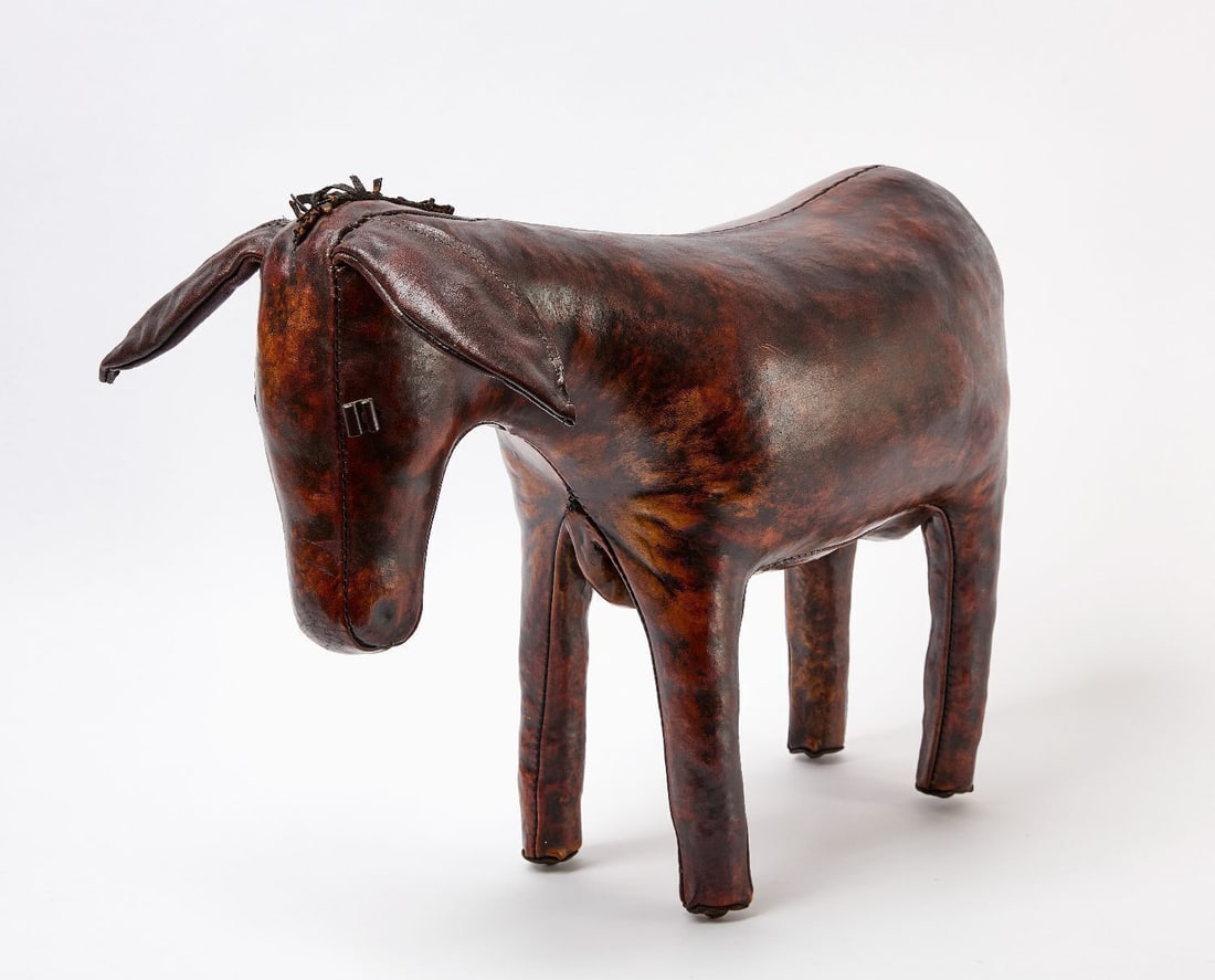 Dimitri Omersa - Leather Donkey Footstool for Abercrombie & Fitch: Dimitri Omersa (Omersa & Co., England). Leather donkey-form footstool, multi-piece sewn leather construction, stamped "Made in England" to underside of one ear, retailed by Abercrombie &