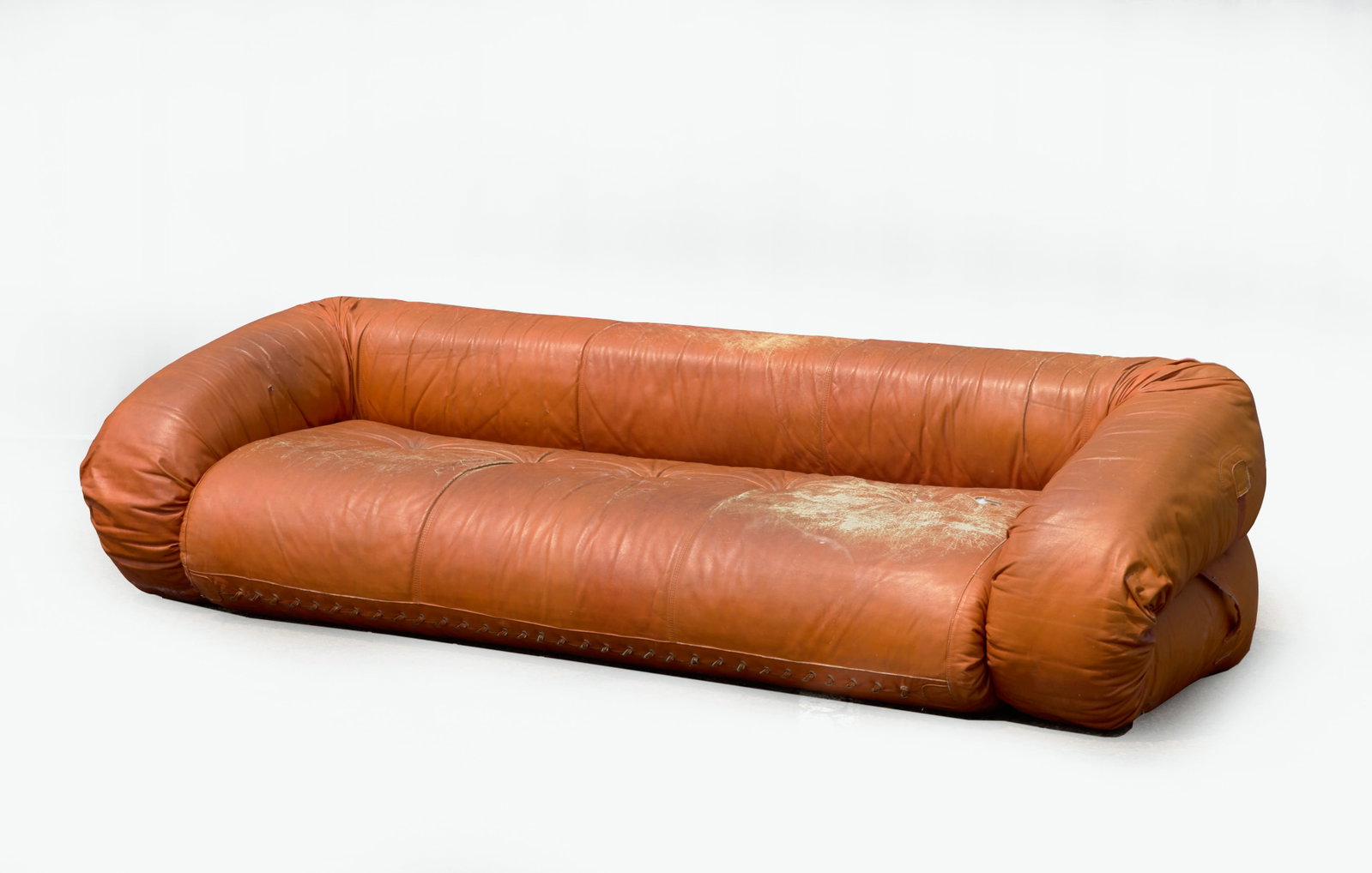 Orange Anfibio Sofa Bed: A convertible sofa bed in the manner of the Anfibio, designed by Alessandro Becchi (Italian, b. 1946) for Giovannetti Collezioni beginning in 1970. Orange leather upholstery with polyurethane