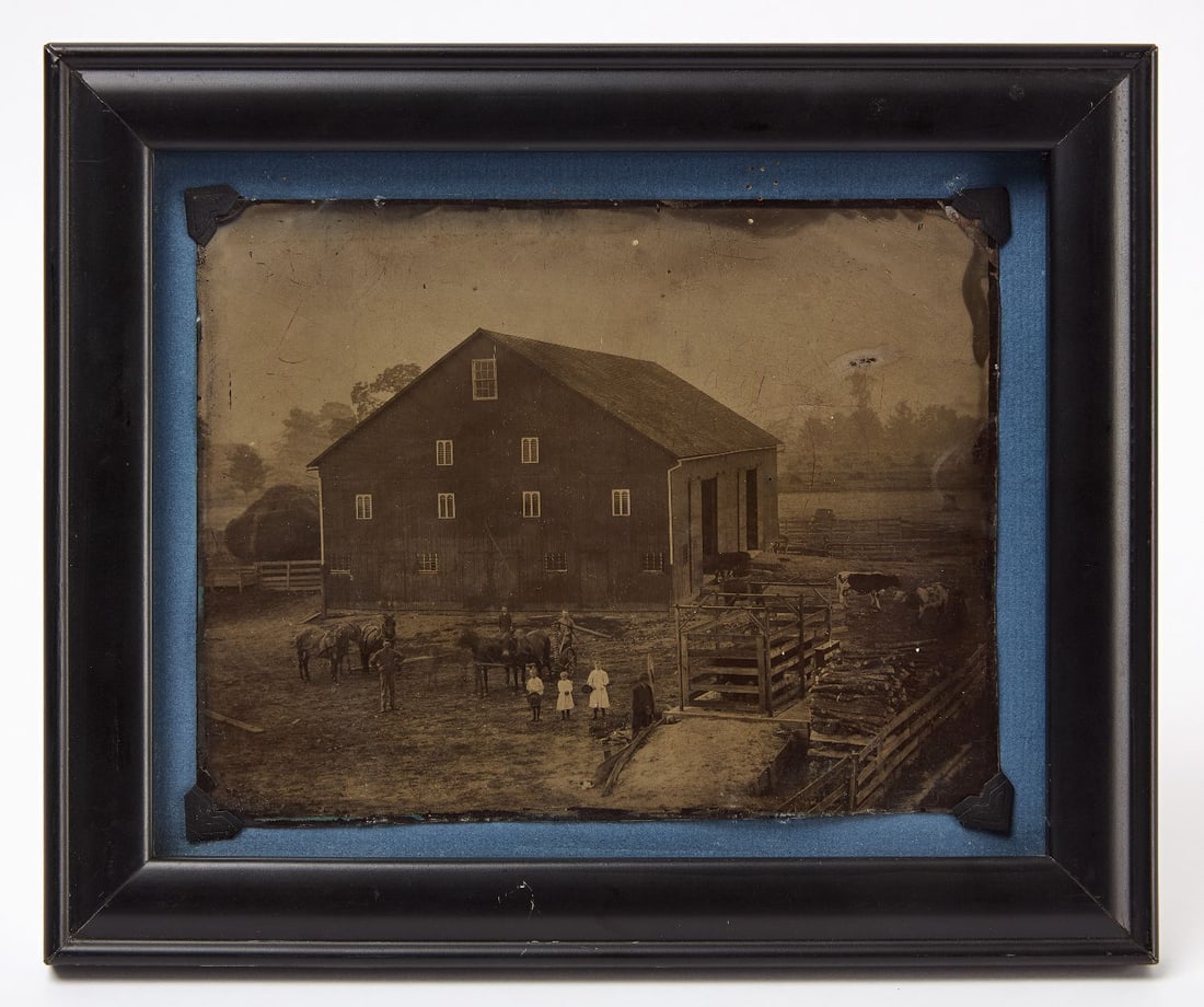Whole Plate Tintype of a Farm Exterior: Whole plate tintype photograph of a farm exterior. Shows a larger barn, horses, cattle, and workers and children. Modern frame. American, circa 1870. H 6-3/4 in W 8-1/2 in.