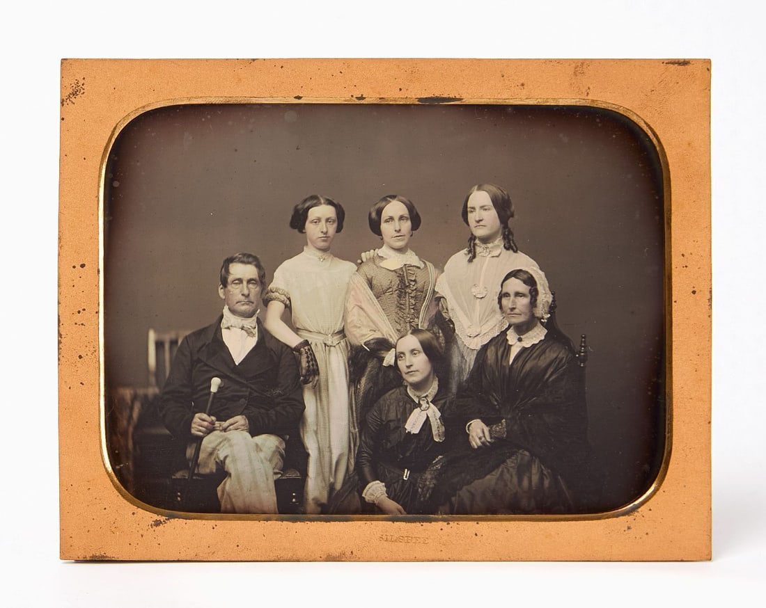 George M. Silsbee - Half Plate Daguerreotype Family Group: George M. Silsbee (Boston, fl. 1851–1862) - Half plate dagurreotype showing a family group, with some applied hand-tinting. Appears to be a father and mother, with their four daughters. Boston,