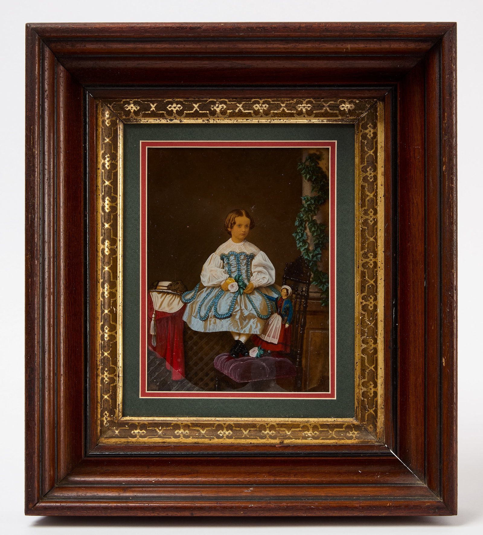 Fine Colored Ivorytype Portrait of a Girl with Doll: Fine colored ivorytype portrait of a girl with doll. Housed in a period mahogany frame (probably later mat). American, circa 1860-70. Frame: H 15-1/4 in. W 13-3/8 in. Mat Opening: H 7-3/4 in. W 5-3/4 