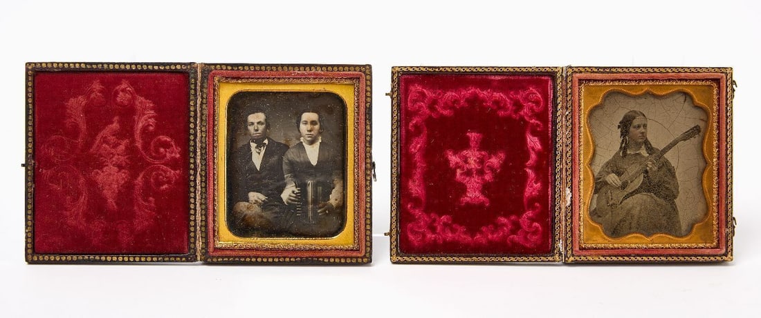 Two Early Images of Female Musicians: Two cased images of female musicians. 1/6 daguerreotype of a woman with concertina, sitting next to a man. 1/6 ambrotype of a young lady holding an acoustic guitar. Both in full leatherette cases. Ame
